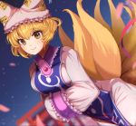  1girl animal_ears blonde_hair blue_tabard closed_mouth dress fox_ears fox_tail frills goma_(u_p) hands_in_opposite_sleeves hat kitsune kyuubi leaning_forward looking_at_viewer multiple_tails pillow_hat raised_eyebrow sky smile solo star_(sky) starry_sky tabard tail tassel touhou white_dress yakumo_ran yellow_eyes 