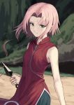  1girl atsuyah0310 bangs bare_arms bare_shoulders black_shorts blurry blurry_background breasts closed_mouth commentary_request cowboy_shot cutting_hair day depth_of_field dress green_eyes haruno_sakura holding holding_weapon kunai looking_at_viewer naruto naruto_(series) outdoors parted_bangs pink_hair red_dress serious severed_hair short_hair shorts sleeveless sleeveless_dress small_breasts solo weapon zipper zipper_pull_tab 