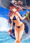  1girl bangs bikini blue_bikini blue_sky bosutonii bracelet breasts cleavage closed_mouth cloud day fate/grand_order fate_(series) hair_between_eyes highres holding innertube jewelry large_breasts long_hair looking_at_viewer ocean orange_ribbon outdoors parasol pink_hair ribbon shiny shiny_hair side-tie_bikini sideboob sky smile solo standing swimsuit tamamo_(fate)_(all) tamamo_no_mae_(swimsuit_lancer)_(fate) umbrella underboob very_long_hair yellow_eyes 