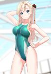  1girl absurdres blonde_hair blue_eyes blurry braid breasts commentary_request competition_swimsuit cowboy_shot depth_of_field green_swimsuit hand_on_hip high_school_fleet highleg highleg_swimsuit highres indoors large_breasts long_hair looking_at_viewer one-piece_swimsuit single_braid solo standing swimsuit takafumi wilhelmina_braunschweig_ingenohl_friedeburg 