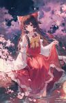  1girl absurdres bangs bow bowtie branch brown_hair bud cherry_blossoms detached_sleeves frilled_bow frills hair_bow hair_tubes hakurei_reimu highres long_hair maccha_(mochancc) night outdoors partially_submerged petals pink_eyes red_bow red_skirt ribbon-trimmed_sleeves ribbon_trim sidelocks skirt skirt_hold skirt_set sky solo star_(sky) starry_sky touhou water yellow_neckwear 