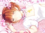  1girl antenna_hair bangs breasts cardcaptor_sakura cherry_blossoms choker closed_mouth commentary dress english_commentary flower frilled_choker frills from_side green_eyes kinomoto_sakura km_(kyoma0) light_brown_hair looking_at_viewer lying magical_girl on_back pink_choker pink_ribbon puffy_short_sleeves puffy_sleeves ribbon short_hair short_sleeves small_breasts smile solo star_(symbol) star_choker white_dress 