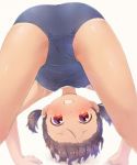  1girl all_fours ass bare_arms bare_shoulders blue_swimsuit blush brown_background brown_hair commentary_request feet_out_of_frame forehead grin looking_at_viewer looking_back looking_through_legs old_school_swimsuit one-piece_swimsuit original pu-en red_eyes school_swimsuit short_twintails smile solo swimsuit tan tanline twintails 