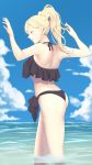  1girl alternate_hairstyle ass bare_legs bikini black_bikini blonde_hair blue_eyes cloud day feet_out_of_frame high_ponytail highres kantai_collection long_hair mole mole_under_eye mole_under_mouth ocean partially_submerged richelieu_(kantai_collection) shingyo sky smile solo swimsuit water 