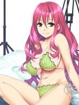  1girl arm_support bangs bikini breasts character_request commentary_request ears eyebrows_visible_through_hair frilled_bikini frills green_bikini hair_between_eyes ino large_breasts long_hair looking_at_viewer navel on_bed pink_hair red_eyes sideboob sitting smile solo string_bikini striped striped_bikini swimsuit underboob very_long_hair wavy_hair white_background 