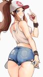  1girl absurdres ass bare_shoulders baseball_cap blue_eyes blue_shorts blush breasts brown_hair cowboy_shot cutoffs denim denim_shorts from_behind hand_up hat high_ponytail highres hilda_(pokemon) holding holding_poke_ball looking_at_viewer looking_back medium_breasts midriff nero_watch parted_lips poke_ball pokemon pokemon_bw short_shorts shorts sidelocks simple_background skindentation solo tank_top thighs white_background white_tank_top 