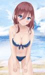  1girl bare_arms bare_legs bare_shoulders beach bikini bikini_bottom bikini_top blue_bikini blue_eyes blush breasts brown_hair cleavage collarbone facing_viewer frilled_bikini frills front-tie_bikini front-tie_top go-toubun_no_hanayome hair_between_eyes hands_on_thighs highres large_breasts long_hair looking_at_viewer midriff nakano_miku nasa_(d-proglution) navel ocean sand smile solo standing swimsuit thighs underboob upper_body white_frills 