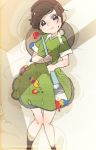  1girl adeleine bed_sheet beret black_eyes black_legwear blush brown_hair closed_mouth commentary dress eyebrows_visible_through_hair flat_chest from_above green_dress hands_up happy hat head_tilt highres holding kirby_(series) knees_together_feet_apart kuroi_moyamoya light_blush looking_at_viewer lying nose_blush on_back paint paintbrush palette red_headwear short_hair short_sleeves smile socks solo splatter sweat white_background 