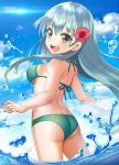  1girl aqua_hair ass bikini blue_sky cloud cowboy_shot day flower from_behind green_bikini green_eyes hair_flower hair_ornament hibiscus kantai_collection long_hair looking_at_viewer looking_back open_mouth outdoors sky smile solo standing suzuya_(kantai_collection) swimsuit upper_teeth wading water yumi_yumi 