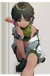  1girl bangs bare_shoulders between_legs black_hair bracelet breasts buttercup_(ppg) candy chain_necklace dark_skin feet_out_of_frame food food_in_mouth green_eyes green_footwear green_skirt grey_background hand_between_legs hand_up head_rest highres jacket jewelry knee_up koyubita lollipop looking_at_viewer midriff mouth_hold off_shoulder outstretched_leg pleated_skirt powerpuff_girls ring shoes short_hair sitting skirt skirt_set sleeveless small_breasts solo white_jacket 