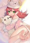  1girl acidear animal_hat ash_arms blush embarrassed fang feet green_eyes hair_between_eyes hat highres lying maus_(ash_arms) medium_hair on_side open_mouth pajamas red_hair solo stuffed_animal stuffed_toy 