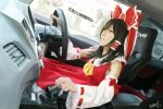  artist_name black_hair bow brown_eyes brown_hair car_interior car_seat commentary cosplay dated detached_sleeves driving english_commentary frilled_bow frills gear_shift hair_bow hair_tubes hakurei_reimu hakurei_reimu_(cosplay) highres long_hair noelsahelangi nontraditional_miko photorealistic red_bow red_shirt red_skirt shirt signature skirt solo touhou vehicle_interior wheel wide_sleeves yellow_neckwear 