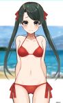  1girl arms_behind_back bangs beach bikini blue_sky breasts cowboy_shot day green_hair grey_eyes hair_ribbon halter_top halterneck highres kantai_collection kozu_(bloomme1_me) long_hair looking_at_viewer mikuma_(kantai_collection) navel ocean outdoors red_bikini red_ribbon ribbon sand side-tie_bikini sky small_breasts solo standing stomach swept_bangs swimsuit twintails water 
