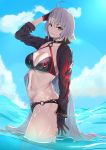  1girl ahoge bikini black_bikini black_choker black_gloves black_jacket blue_sky choker cloud cropped_jacket fate/grand_order fate_(series) fuaru gloves highres jacket jeanne_d&#039;arc_(alter_swimsuit_berserker) jeanne_d&#039;arc_(fate)_(all) long_hair o-ring o-ring_bikini o-ring_bottom o-ring_top ocean shrug_(clothing) silver_hair sky swimsuit very_long_hair wading waves yellow_eyes 