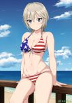  1girl american_flag_bikini anastasia_(idolmaster) bangs bare_shoulders beach bikini blue_eyes blue_sky breasts cleavage closed_mouth cloud collarbone day eyebrows_visible_through_hair flag_print front-tie_bikini front-tie_top hair_between_eyes horizon idolmaster idolmaster_cinderella_girls inoshira light_smile looking_at_viewer navel ocean outdoors sand shiny shiny_hair shiny_skin short_hair sky solo swimsuit thighs twitter_username water wooden_railing 