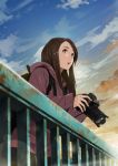  1girl absurdres against_railing awestruck backpack bag blurry bokeh brown_eyes brown_hair camera depth_of_field hair_ornament hairclip highres holding holding_camera hood hooded_jacket jacket long_hair looking_afar original parted_lips photoshop_(medium) railing sky solo somehira_katsu sunset 