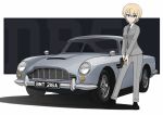  1girl absurdres alternate_costume aston_martin aston_martin_db5 blonde_hair blue_eyes braid car contrapposto darjeeling_(girls_und_panzer) french_braid girls_und_panzer grey_suit ground_vehicle gun handgun highres james_bond_(series) kano_(nakanotakahiro1029) motor_vehicle necktie pistol smile solo walther walther_ppk weapon 