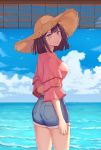  1girl :d absurdres ass bamboo_screen bangs black_hair blouse blue_eyes blunt_bangs blush breasts day denim denim_shorts from_behind hat highres holding_arm horizon looking_at_viewer looking_back ocean open_mouth original outdoors pink_blouse shade short_shorts shorts smile solo standing straw_hat sunlight twisted_torso yi_fang_xiaosheng 
