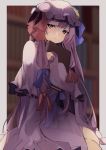  1girl blue_ribbon book book_hug bookshelf capelet commentary crescent crescent_moon_pin dress hair_ribbon hat hat_ribbon highres holding holding_book long_hair long_sleeves looking_at_viewer mob_cap patchouli_knowledge purple_dress purple_eyes purple_hair purple_headwear red_ribbon ribbon solo touhou tsushi upper_body 