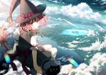  1girl back bangs black_cat black_dress broom broom_riding cat cityscape cloud day dress eyebrows_visible_through_hair hat headwear highres jewelry koh_rd looking_at_viewer medium_hair original pendant pink_hair ribbon scenery short_sleeves sitting sky solo water witch witch_hat 