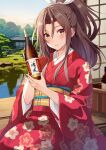  1girl architecture bottle brown_eyes brown_hair building commission day east_asian_architecture floral_print_kimono furisode hair_ribbon high_ponytail highres holding holding_bottle japanese_clothes kanden_sky kantai_collection kimono looking_at_viewer obi pixiv_commission pond red_kimono ribbon sash shouji sitting sliding_doors smile solo white_ribbon wide_sleeves wooden_floor zuihou_(kancolle) 