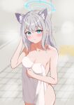  1girl absurdres animal_ear_fluff animal_ears bathroom bathtub blue_archive blue_halo blush breasts cleavage closed_mouth commentary_request cowboy_shot extra_ears green_eyes grey_hair halo hand_up highres hojichabu indoors long_hair looking_at_viewer medium_breasts mismatched_pupils naked_towel revision shiroko_(blue_archive) solo standing towel wolf_ears 