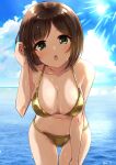  1girl bare_arms bare_legs bare_shoulders bikini blue_sky blush breasts brown_hair chestnut_mouth cleavage cloud cloudy_sky collarbone cowboy_shot day dot_nose fang gold_bikini green_eyes hand_in_own_hair hand_on_own_thigh highres horizon idolmaster idolmaster_cinderella_girls idolmaster_cinderella_girls_starlight_stage large_breasts looking_at_viewer maekawa_miku navel ocean paopao parted_bangs short_hair sidelocks sky solo straight_hair sunlight swimsuit twitter_username 