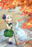  1girl arms_up autumn_leaves bangs black_footwear blush broom calcmis_gowa commentary_request day from_above green_eyes green_skirt green_vest hair_ribbon highres holding holding_broom konpaku_youmu konpaku_youmu_(ghost) leaf loafers long_sleeves looking_up maple_leaf outdoors ribbon shirt shoes short_hair silver_hair skirt smile solo stepping_stones stone_walkway touhou vest white_legwear white_shirt 