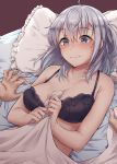  1girl absurdres bed_sheet black_bra blanket blue_eyes blush bra breasts cleavage closed_mouth collarbone eyebrows_visible_through_hair hair_between_eyes highres kantai_collection kiritto large_breasts long_hair one_side_up pillow silver_hair solo_focus suzutsuki_(kantai_collection) underwear 