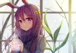  1girl absurdres animal_ears animal_print beige_jacket blurry blurry_background blush bow bunny_ears bunny_print closed_mouth cup diving_penguin eyebrows_visible_through_hair hair_between_eyes hair_bow highres holding holding_cup hot_drink long_hair looking_at_viewer mug plaid plaid_scarf purple_eyes purple_hair reisen_udongein_inaba scarf smile snow solo steam touhou tree upper_body window winter_clothes yellow_bow 