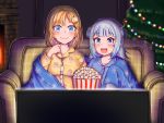  2girls bangs blonde_hair blue_eyes blue_hair christmas christmas_ornaments christmas_tree couch dolyawatchira573 fireplace food gawr_gura hair_ornament highres hololive hololive_english monocle_hair_ornament multicolored_hair multiple_girls open_mouth pajamas popcorn shared_blanket short_hair sitting streaked_hair television virtual_youtuber watching_television watson_amelia 