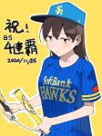  1girl alternate_costume alternate_hairstyle baseball_cap baseball_jersey blue_headwear blue_shirt brown_eyes brown_hair commentary_request dated fukuoka_softbank_hawks hair_down hat highres kaga_(kantai_collection) kantai_collection looking_at_viewer masukuza_j nippon_professional_baseball shirt solo translation_request upper_body 