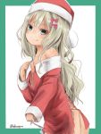  1girl akino_shuu blonde_hair blush bow christmas closed_mouth collarbone commentary_request cowboy_shot grecale_(kantai_collection) green_eyes hair_between_eyes hair_bow hat jewelry kantai_collection long_hair long_sleeves pink_bow ring santa_costume santa_hat smile solo tongue tongue_out twitter_username wedding_band 