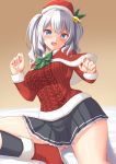  1girl black_skirt blue_eyes blush breasts capelet frilled_skirt frills fur-trimmed_capelet fur-trimmed_headwear fur_trim hat kantai_collection kashima_(kantai_collection) large_breasts long_sleeves miniskirt pleated_skirt red_capelet red_headwear red_sweater santa_costume santa_hat sidelocks silver_hair skirt solo sweater tokyo_yamane twintails wavy_hair 