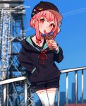  1girl absurdres badge baseball_cap black_headwear black_hoodie blurry blurry_background bubble_tea cio_hakatano cityscape commentary_request cowboy_shot cup drinking drinking_straw hair_tie handrail hat highres holding holding_cup hood hoodie kotonoha_akane leaning_back medium_hair pink_eyes pink_hair shorts thighhighs tower voiceroid white_legwear 