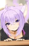  1girl :3 ahoge animal_ear_fluff animal_ears bangs black_collar black_hoodie blurry blurry_background blush breasts cat_ears cat_tail cleavage closed_mouth collar commentary_request crossed_bangs eyebrows_visible_through_hair fang hair_between_eyes hair_intakes highres hololive hood hoodie leaning_forward looking_at_viewer medium_breasts nejime nekomata_okayu purple_eyes purple_hair short_hair signature skin_fang solo table tail upper_body virtual_youtuber 