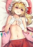  1girl blonde_hair blush breasts commentary_request crystal culter flandre_scarlet gloves hands_on_own_chest hat highres long_hair looking_at_viewer lying medium_breasts mob_cap navel nipples on_back pillow pointy_ears red_eyes red_skirt side_ponytail skirt solo stomach touhou white_gloves white_headwear wings 
