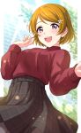  1girl :d absurdres bangs belt black_skirt blurry blurry_background blush breasts brown_hair day depth_of_field eyebrows_visible_through_hair hair_ornament hairclip hand_up highres koizumi_hanayo long_sleeves looking_at_viewer love_live! love_live!_school_idol_project medium_breasts open_mouth outdoors plaid plaid_skirt purple_eyes red_sweater sekina short_hair skirt smile solo sweater swept_bangs upper_teeth 