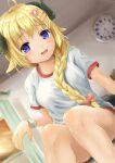  1girl :d absurdres animal_ears bangs blonde_hair blurry blurry_background blush bow braid breasts clock commentary_request curled_horns depth_of_field dutch_angle eyebrows_visible_through_hair feet_out_of_frame gym_shirt gym_shorts gym_uniform hair_bow hair_over_shoulder highres hololive horns indoors long_hair looking_at_viewer medium_breasts ohiensis open_mouth pink_bow purple_eyes red_shorts sheep_ears sheep_girl sheep_horns shirt short_shorts short_sleeves shorts single_braid sitting smile solo sweat tsunomaki_watame very_long_hair virtual_youtuber wall_clock wristband 