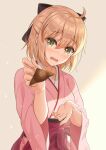  1girl ahoge bangs black_bow blonde_hair blush bow commentary_request embarrassed eyebrows_visible_through_hair fate/grand_order fate_(series) feeding food green_eyes hair_between_eyes hair_bow hakama half_updo head_tilt japanese_clothes kimono long_sleeves looking_at_viewer matsuba_moco okita_souji_(fate) okita_souji_(fate)_(all) open_mouth pink_hakama pink_kimono short_hair sidelocks solo standing upper_body wagashi wavy_mouth wide_sleeves 