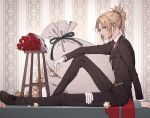  1girl bambi-25 bangs blonde_hair bouquet braid chair collar eyebrows_visible_through_hair fate/apocrypha fate/grand_order fate_(series) flower formal french_braid from_side gloves gloves_removed green_eyes hair_ornament hair_scrunchie highres long_hair long_pants looking_at_viewer mordred_(fate) mordred_(fate)_(all) necktie open_mouth pants ponytail red_flower red_scrunchie rose sack saint_quartz scrunchie shoes sitting smile solo suit 
