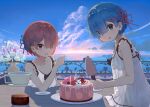  2girls absurdres akatsuki_(m12778387) alternate_costume bangs bare_arms bare_shoulders blue_eyes blue_hair blue_sky blunt_bangs blush breasts cake cloud collarbone commentary_request cup day dress eyebrows_visible_through_hair flower food glass hair_ornament hair_over_one_eye hair_ribbon highres holding holding_cup horizon looking_at_viewer multiple_girls ocean open_mouth outdoors pink_hair pink_ribbon plant plate ram_(re:zero) re:zero_kara_hajimeru_isekai_seikatsu red_eyes rem_(re:zero) ribbon see-through short_hair siblings sisters sky sleeveless sleeveless_dress smile table twins white_flower x_hair_ornament 