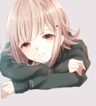  1girl bangs black_jacket closed_mouth danganronpa_(series) danganronpa_2:_goodbye_despair eyebrows_visible_through_hair face flipped_hair grey_background hair_ornament jacket kuro_n314 long_sleeves looking_at_viewer medium_hair nanami_chiaki sleeves_past_wrists smile solo spaceship_hair_ornament 