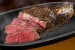  blurry bowl commentary food food_focus hokkaido_(artist) meat no_humans original realistic sauce steak steam still_life 