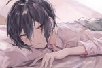  1boy ahoge bangs bed_sheet black_hair blush closed_mouth collared_shirt danganronpa_(series) danganronpa_v3:_killing_harmony goto_(sep) hair_between_eyes highres long_sleeves looking_at_viewer lying male_focus necktie on_stomach open_mouth pillow saihara_shuuichi shirt short_hair solo under_covers white_shirt 