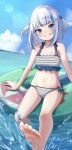  1girl bare_arms bare_legs bare_shoulders barefoot bikini blue_eyes blue_hair blue_sky blue_tail blunt_bangs cloud collarbone commentary day english_commentary feet fins fish_tail flat_chest gawr_gura grin highres hololive hololive_english looking_at_viewer multicolored_hair navel ocean on_innertube outdoors shark_tail sharp_teeth sky smile soles solo stomach striped_bikini striped_clothes sunlight swimsuit tail teeth toes tomu_(nuri_pic) virtual_youtuber water white_hair 