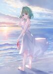  1girl bangs bare_arms bare_shoulders barefoot beach blue_sky breasts brown_footwear closed_mouth cloud cloudy_sky dress eyebrows_visible_through_hair footprints from_behind green_eyes green_hair hair_between_eyes hand_up highres holding holding_clothes holding_footwear horizon looking_at_viewer looking_back meito_(maze) morinaka_kazaki nijisanji ocean outdoors sand sandals sandals_removed sky sleeveless sleeveless_dress small_breasts smile solo standing sun_(symbol) sunset virtual_youtuber water waves white_dress 