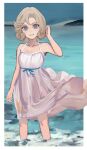  1girl bangs bare_shoulders blonde_hair blue_eyes blush border day dress eyebrows_visible_through_hair eyelashes grin highres janus_(kancolle) kantai_collection kkkhosuke ocean outdoors parted_bangs short_hair sky sleeveless sleeveless_dress smile solo sundress wading water white_border white_dress 