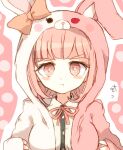  1girl animal_ears animal_hood bangs blush_stickers bunny_ears bunny_hood collared_shirt commentary_request cosplay danganronpa_(series) danganronpa_2:_goodbye_despair dress_shirt fake_animal_ears hood hood_up light_brown_hair looking_at_viewer mari_audio monomi_(danganronpa) monomi_(danganronpa)_(cosplay) nanami_chiaki neck_ribbon pink_background pink_eyes pink_hair pink_ribbon pout ribbon shiny shiny_hair shirt solo translation_request upper_body white_background 