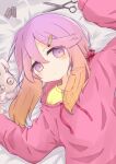  1girl arm_up bangs bed_sheet blush brown_hair closed_mouth commentary damaged drawstring eyebrows_visible_through_hair gradient_hair hair_between_eyes hair_ornament hairclip hand_up highres kantai_collection long_hair long_sleeves looking_at_viewer lying multicolored_hair on_back pill pink_sweater puffy_long_sleeves puffy_sleeves purple_eyes purple_hair ridy_(ri_sui) scissors shirt sleeves_past_wrists solo stuffed_animal stuffed_bunny stuffed_toy sweater symbol_commentary tsushima_(kancolle) upper_body yellow_shirt 